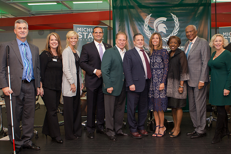 Photo of Gilbert family with MSU Staff and Faculty