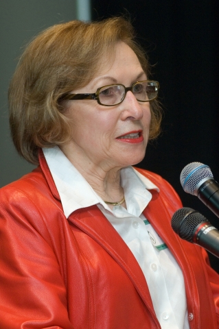 Judy DeLapa wearing a bright red blazer, speaking at the 2008 Awards and Appreciation Reception