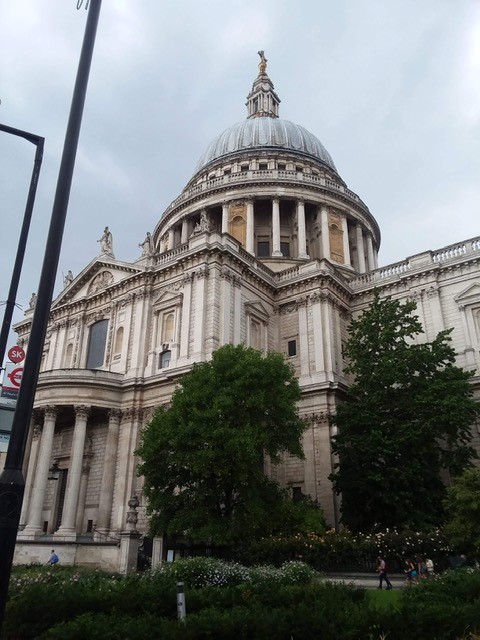 Photo of St. Paul's Cathedral in London, taken from the ground looking up at the building