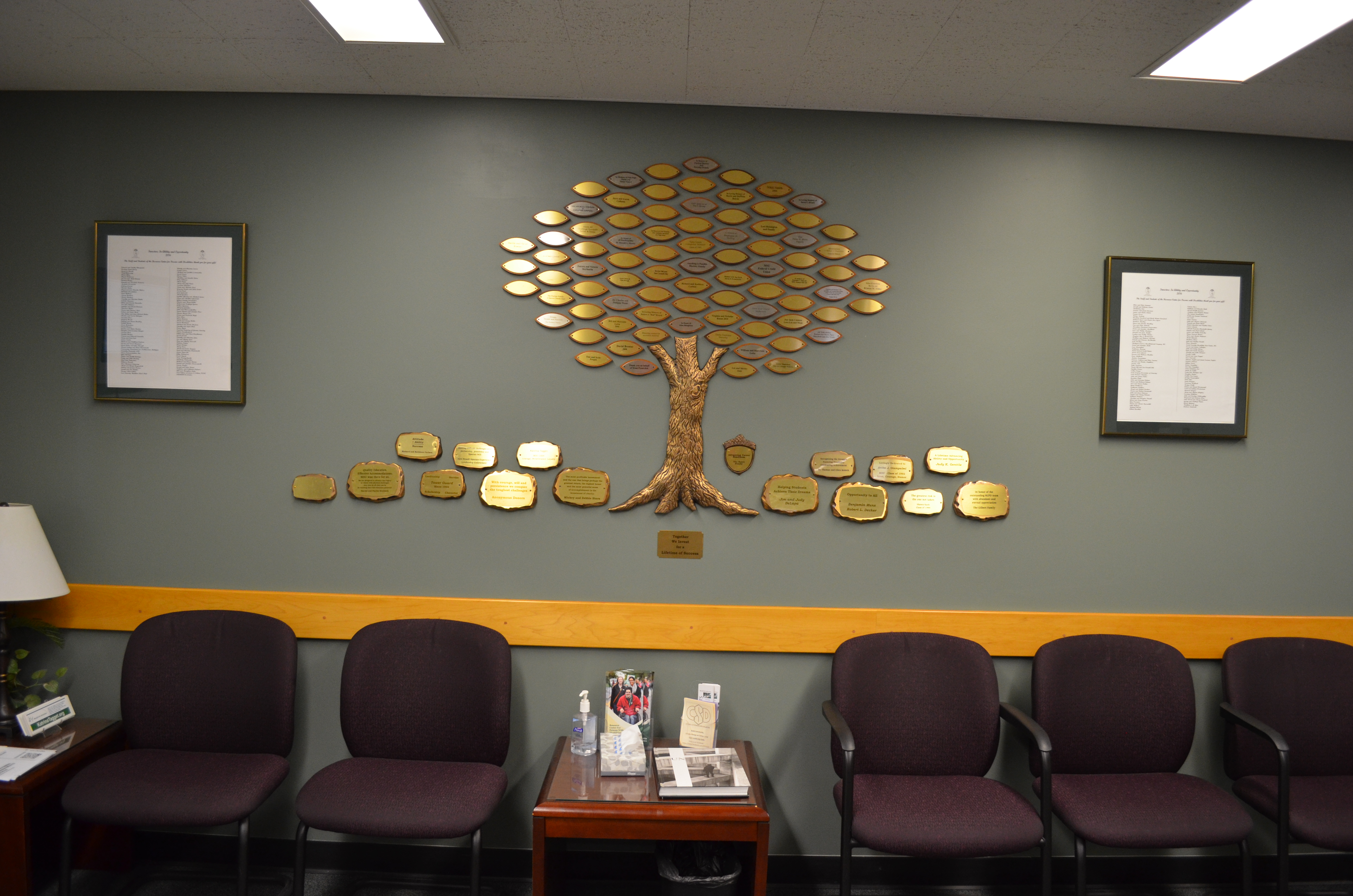 Photo of the wall with the tree, leaves, and rocks mounted to it, unframed