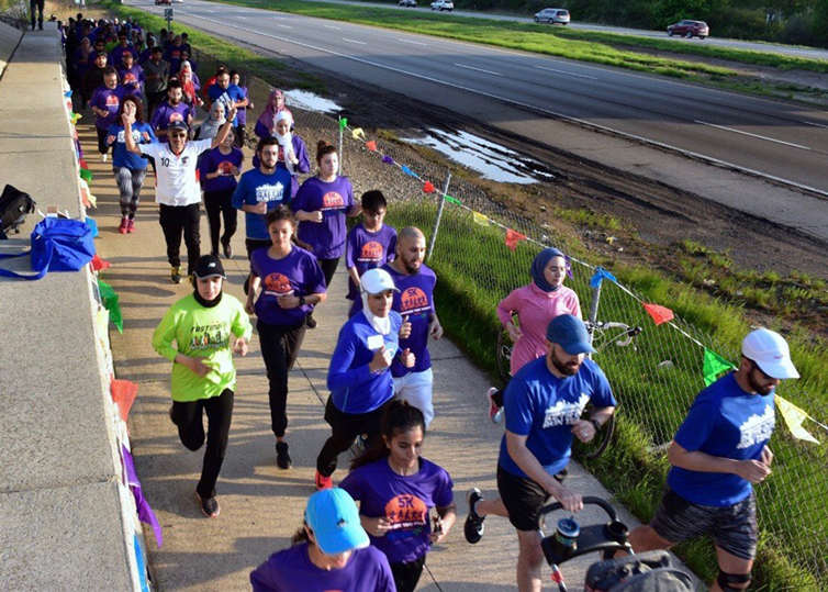 fasting 5k runners making their way toward the finish line