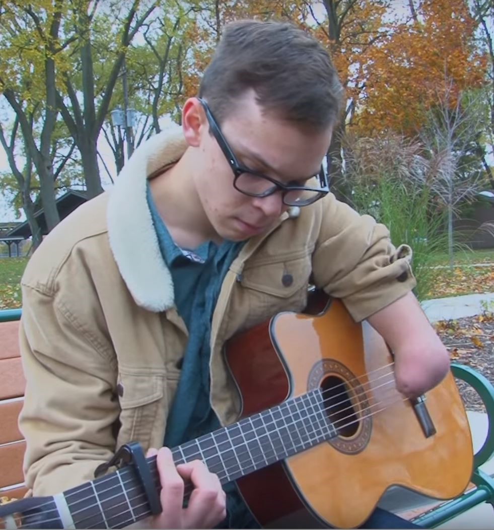 Lee playing guitar