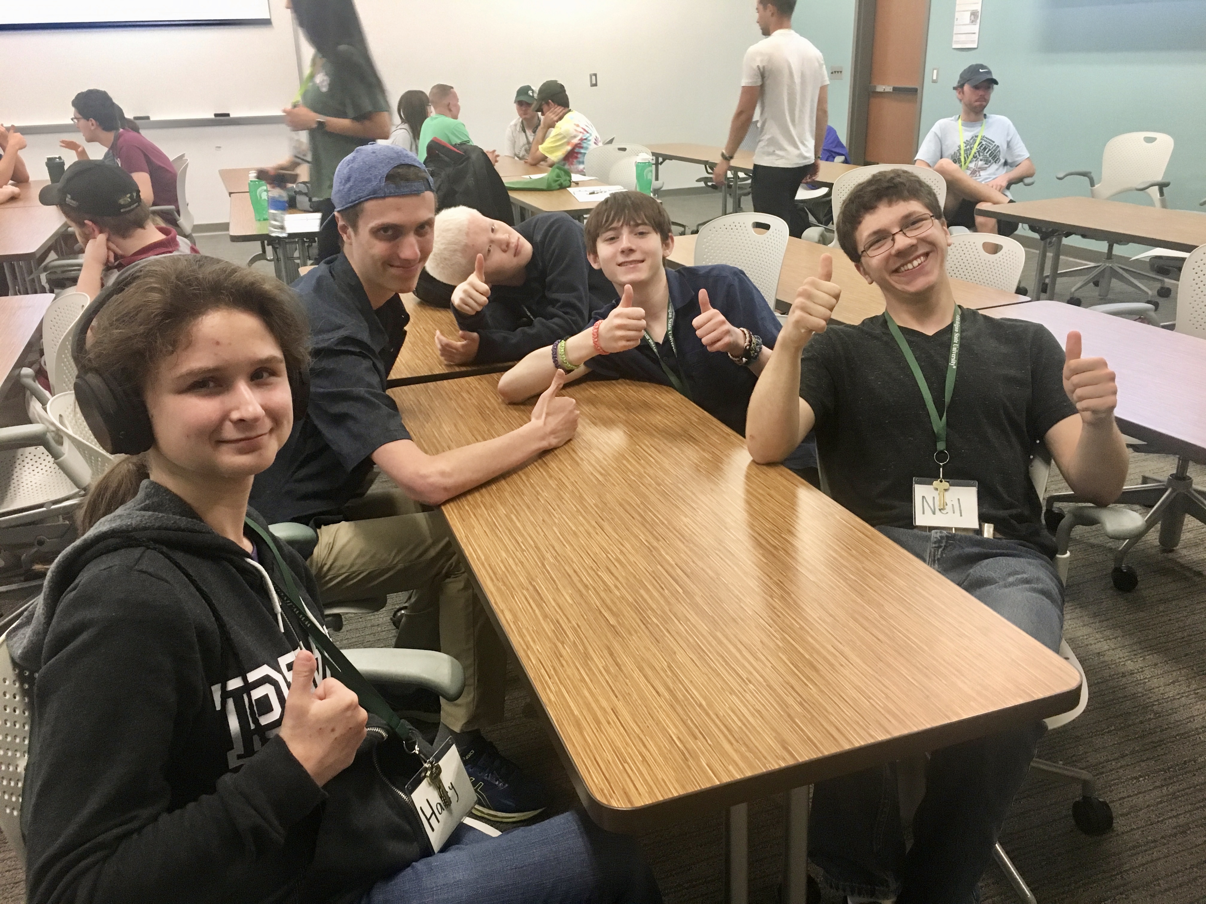 Students sitting together during mock college class.