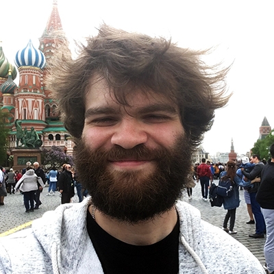 Picture of Justin in Russia with St. Basil's Cathedral in the background