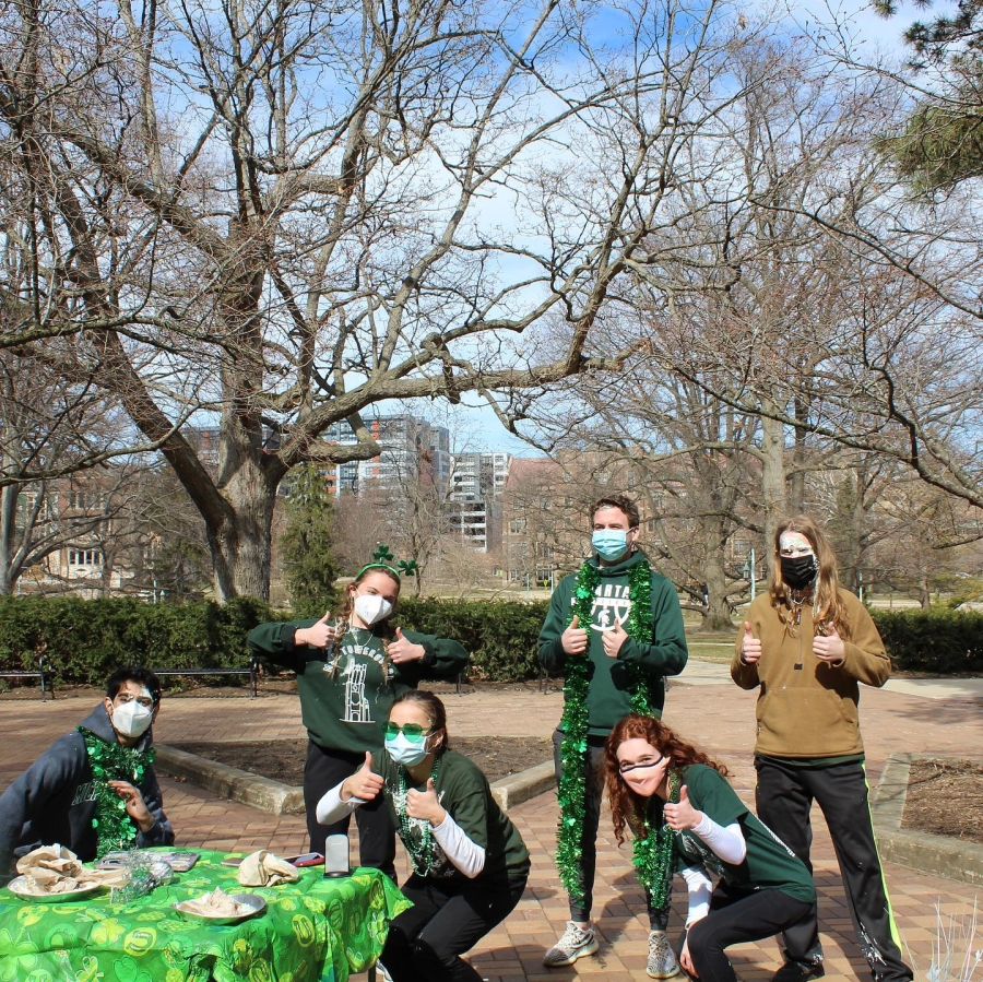 Pictured is Tower Guard e-board members posing with a thumbs up in St. Patricks Day gear.