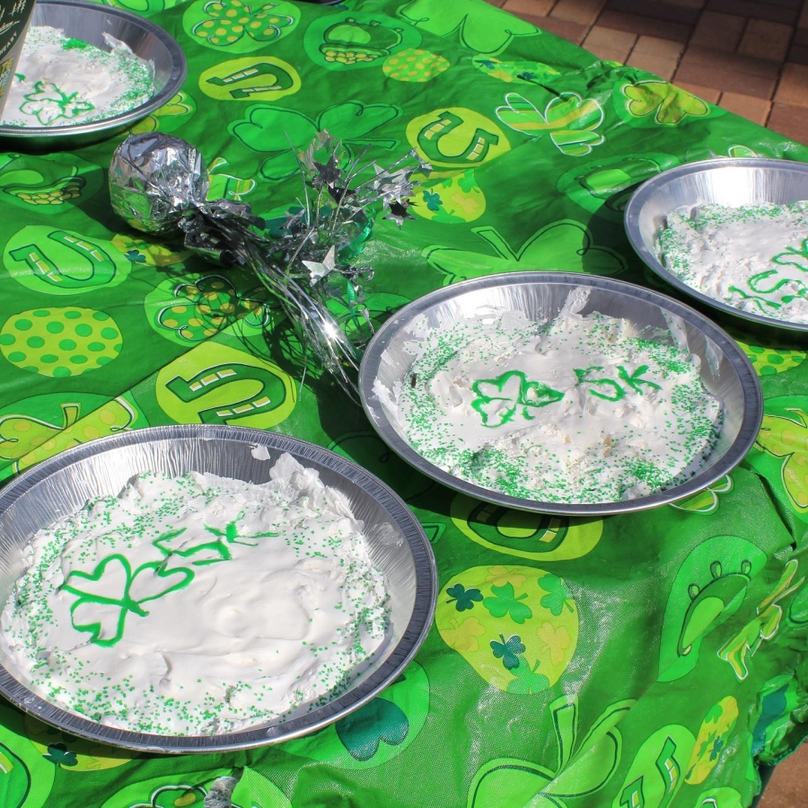 Pictured is Shamrock 5K cream pies on the green decorated table.