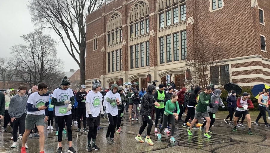 Race participants at the starting line in rainy weather
