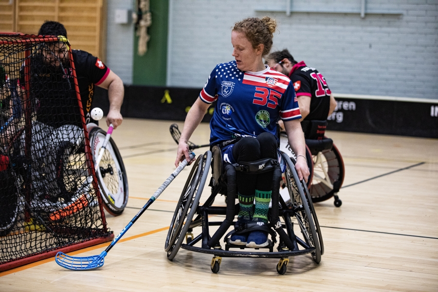 Action shot of teammate playing floorball