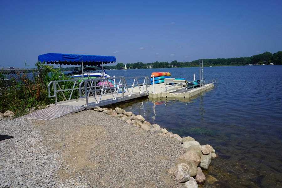 Photo of new accessible dock, complete with a new sea wall, accessible platform, guard rails, and boat launch