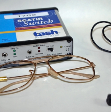 The SCATIR Switch with the wired glasses. The switch is a small box that is around the length and width of a pair of glasses. 