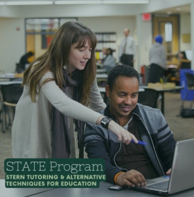 Tutor helps to instruct a student working on a laptop, photo has text that reads "STATE Program" on it. 