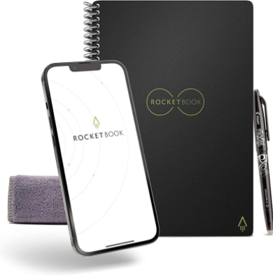 Rocketbook with logo in the middle of the notebook, next to a pen, and cellphone displaying the rocketbook application